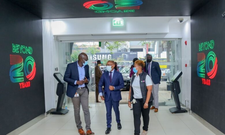 Safaricom HOD Retail Strategy, Franchise and Mobile Care Yudah Yogo, Safaricom Chief Executive Officer Peter Ndegwa, being taken around the newly refurbished shop with Sarah Indetie-Senior Manager Retail Asset Management during the launch of the heavy tech store in Moi avenue. This first-of-a-kind digitized flagship shop has a video tunnel at the entrance, digital interactive screens and device display screens for a wide variety of phones and accessories on sale.