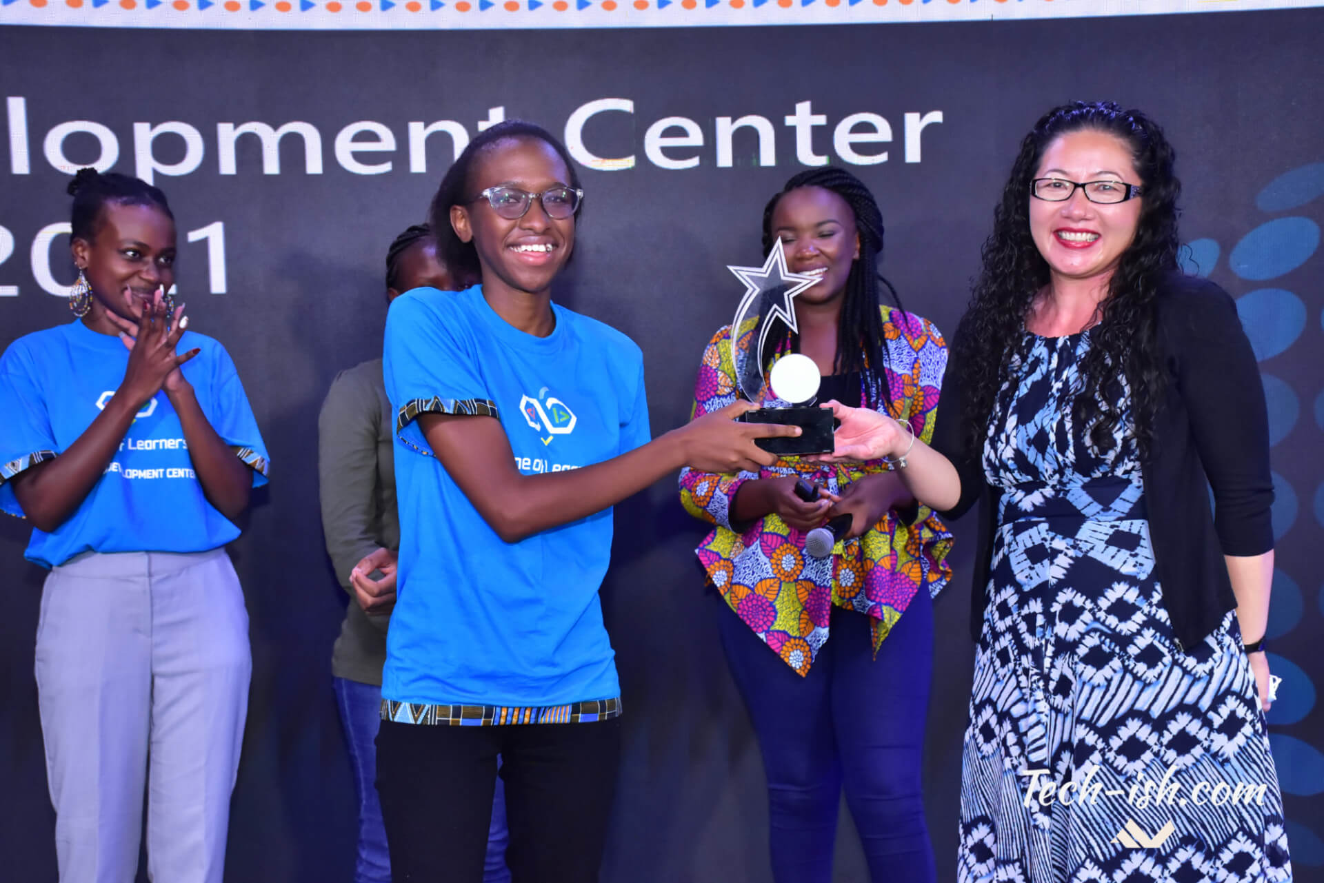 Bethany Jepchumba, a student from the Jomo Kenyatta University of Agriculture and Technology receiving the Award from Ruth Ferland Microsoft Africa Development Center.
