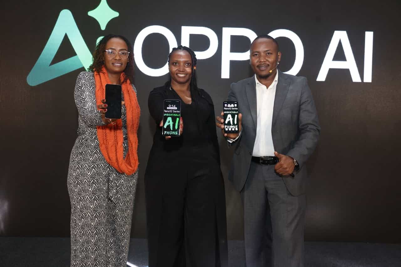 Group photo of the OPPO Kenya team standing together, smiling proudly in front of OPPO AI branded backdrop during the OPPO Reno 12 Series launch event.