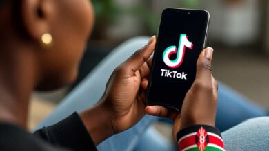 Person holding a smartphone, ready to navigate TikTok promotion features, symbolizing the new advertising opportunities available in Kenya