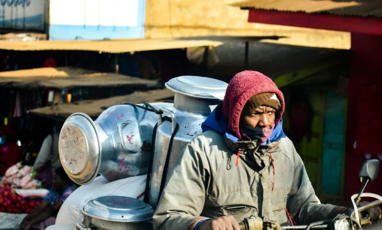 man transporting containers on motorcycle New toolkit aims to reform Kenya’s gig economy, enhancing worker protections, industry standards, and investment, advancing Vision 2030’s digital goals.