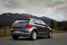 Volkswagen resumes car production in Kenya, aiming to establish a regional hub, focus on sustainability, electric vehicles, and industrial growth. gray car on gray asphalt road