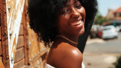 woman in white shirt smiling