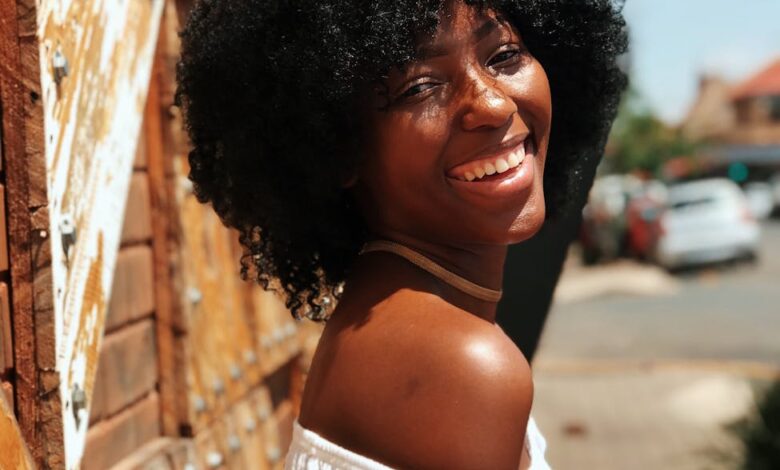 woman in white shirt smiling