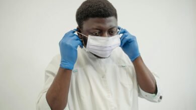 medical professional putting on a face mask