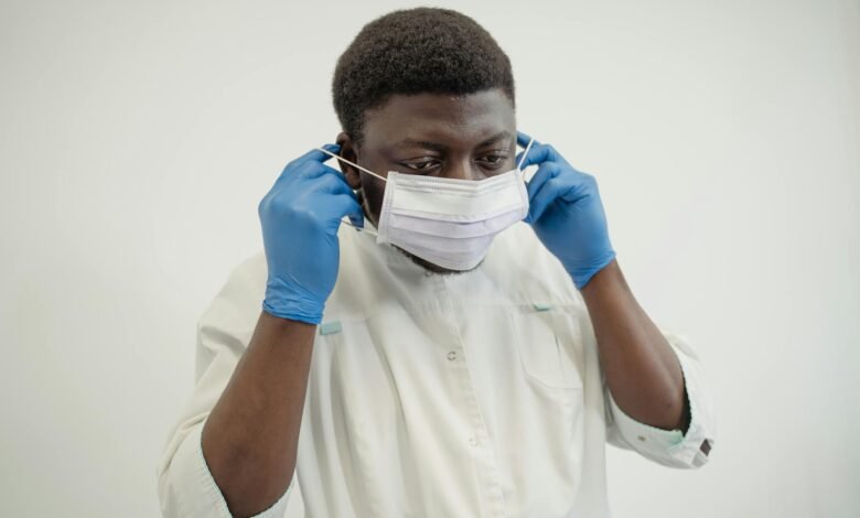 medical professional putting on a face mask