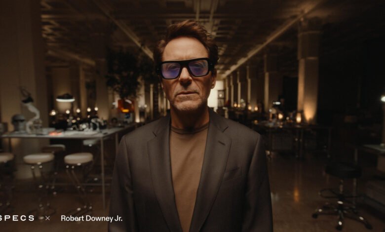 Snapchat users say a Robert Downey Jr. Specs advert interrupts chats and camera access, with a Skip button appearing later.