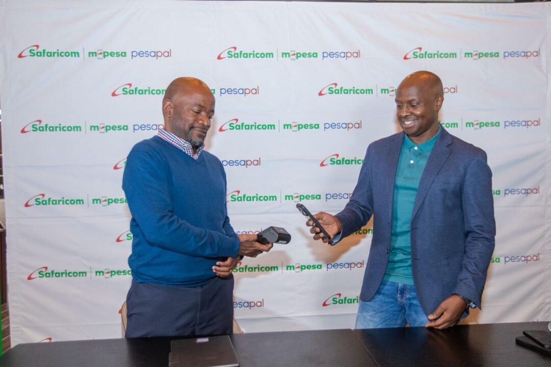 Safaricom and Pesapal roll out M-PESA tap and dynamic QR payments on Pesapal card machines. Customers still enter a PIN Agosta Liko (left)Founder and CEO of Pesapal and James Maitai, Group Chief Technology Officer, Safaricom PLC, demonstrate Tap to Pay during the launch of Safaricom and Pesapal’s Scan to Pay and Tap to Pay payment.